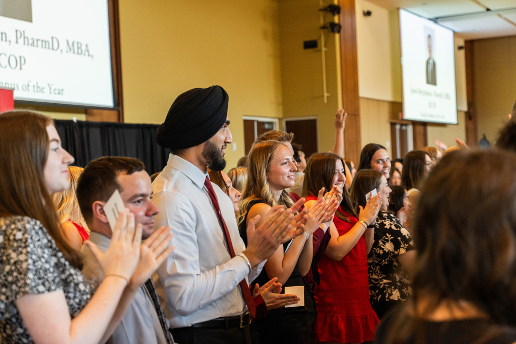 Photo by Paulius Musteikis Students stand and applaud