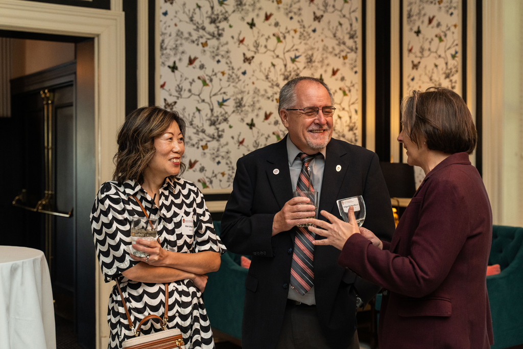 Mel and Idy de Villiers laugh in conversation with Lynne Taylor