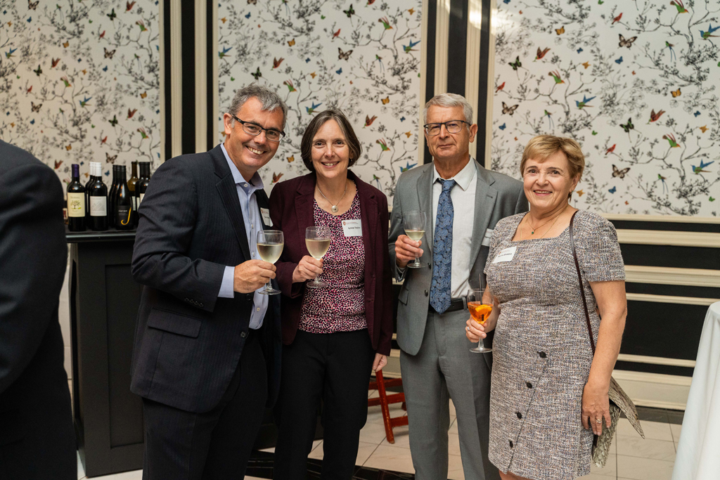 Evgenyi Shaelev and Lynne Taylor pose for a photo with their partners.