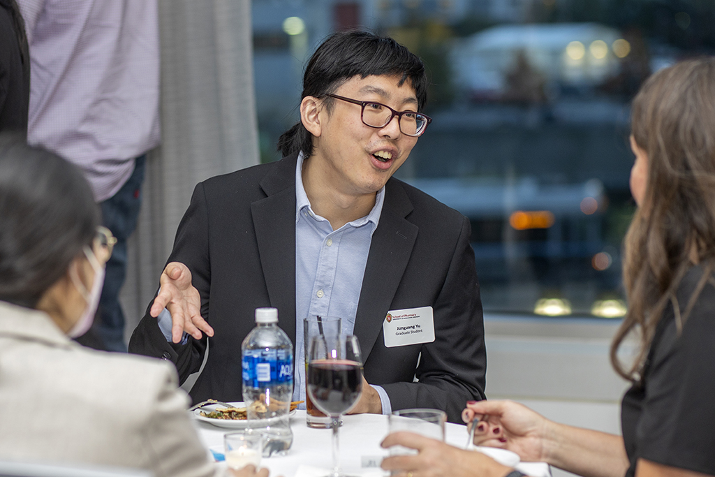 032WU-Boston10-17-22-Osberg Junguang Yu speaking with Lindy Stoll.