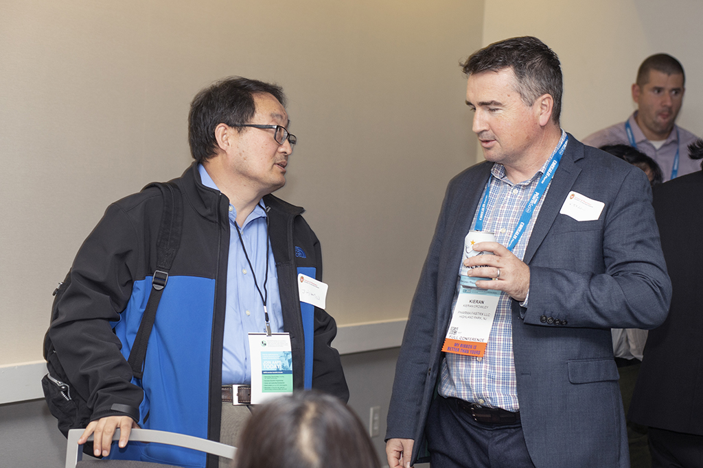 062WU-Boston10-17-22-Osberg Jinjeong Li and Kieran Crowley speaking.