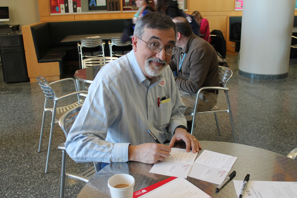 Thank a Badger Day, staff member filling out cards