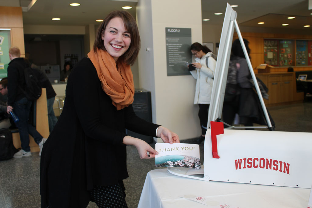Thank a Badger Day with student putting thank you card into mailbox
