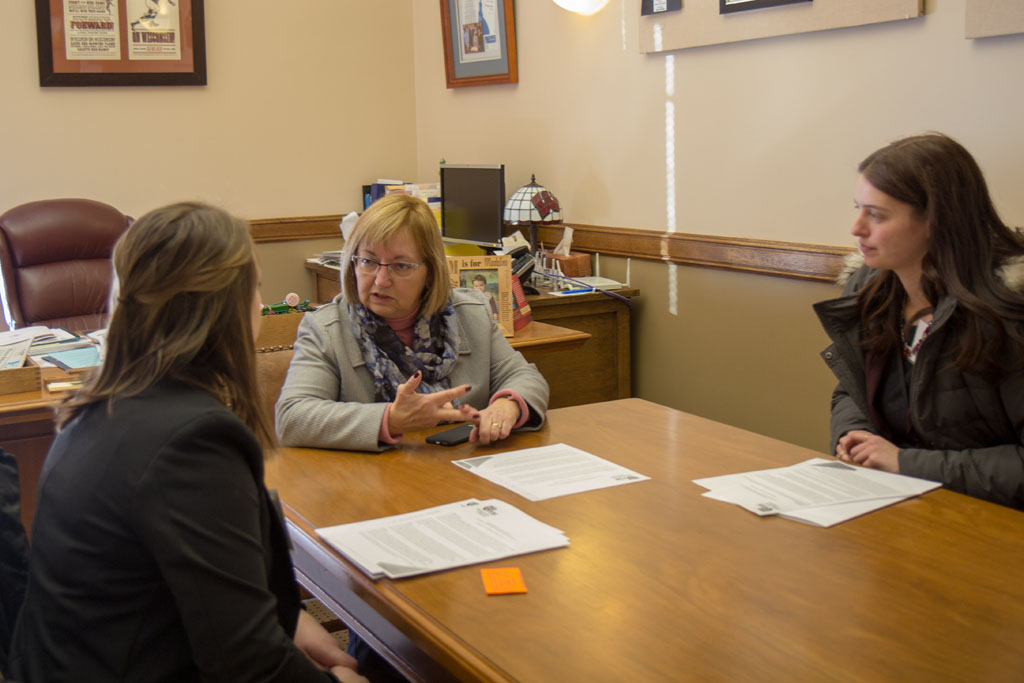 20180208-IMG_3696 Pharmacy students speaking with a legislator at a table