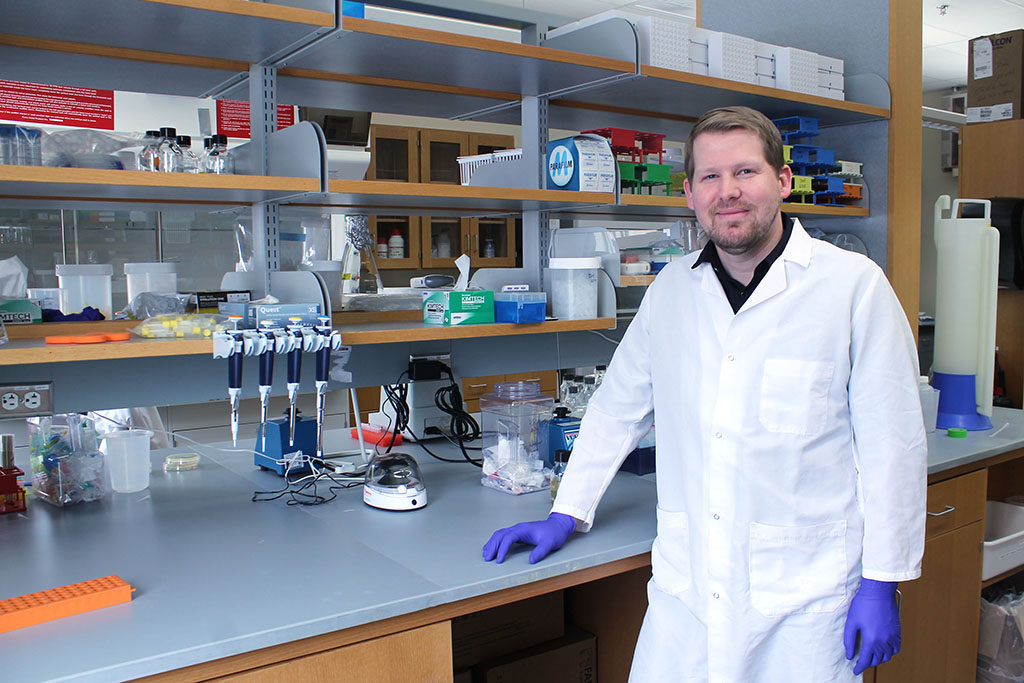 Jason Peters standing at a lab counter