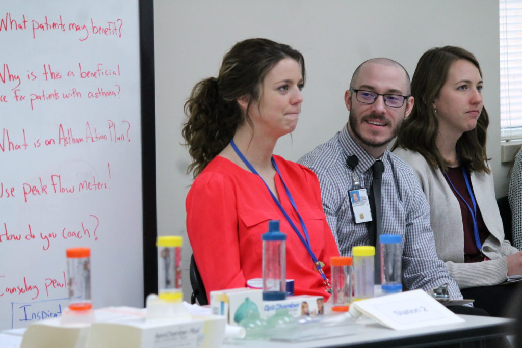 2019-PTx-Asthma-Lab-007 Instructors sitting along wall during asthma lab