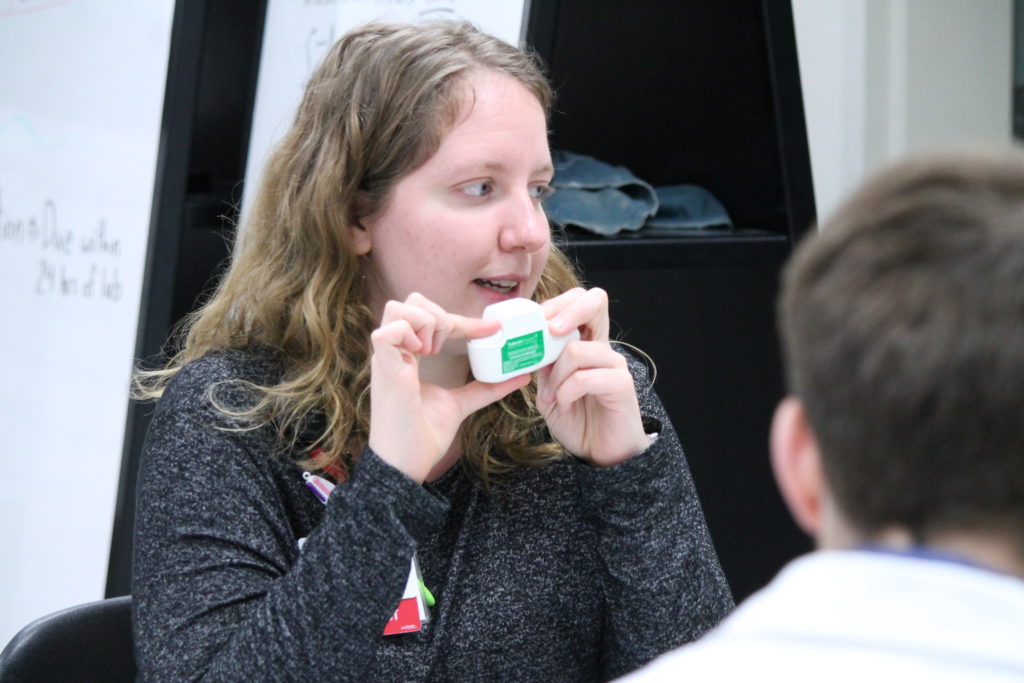 2019-PTx-Asthma-Lab-031 Instructor informing students on medical device for asthma