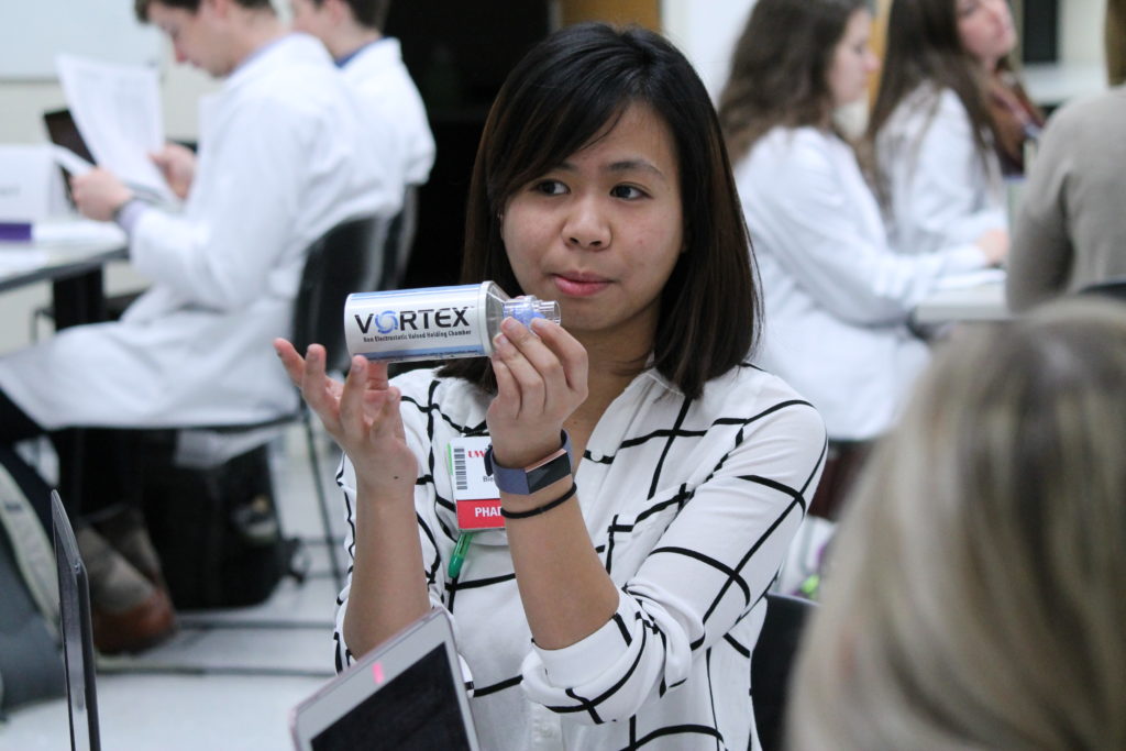 2019-PTx-Asthma-Lab-067 Staff holding up VORTEX asthma inhaler