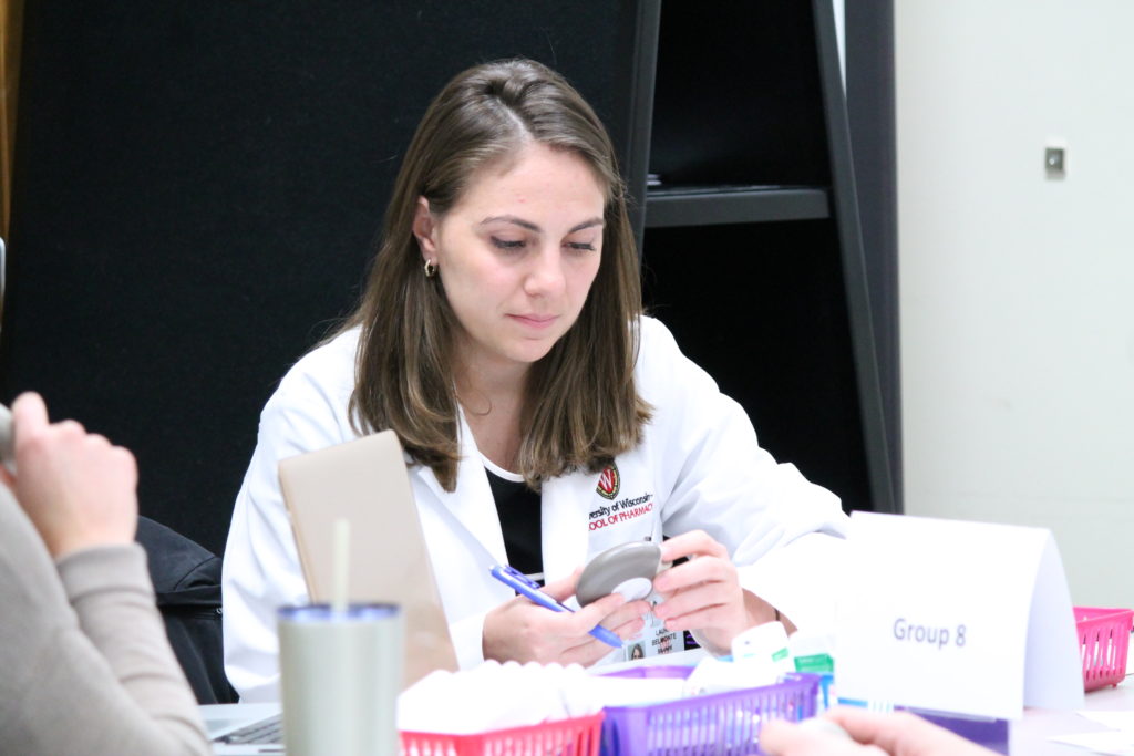 2019-PTx-Asthma-Lab-075 Student looking at asthma device