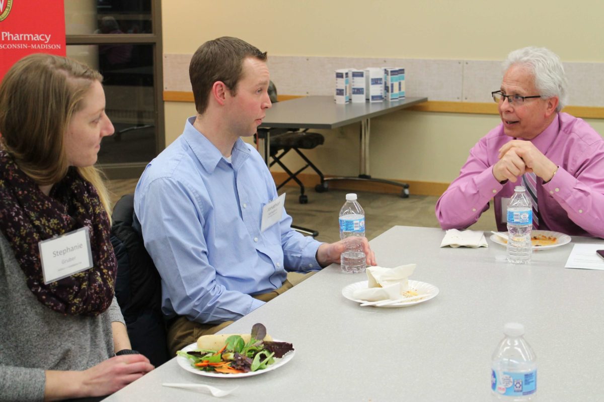 2020-Annual-Clinical-Instructors-Mtg-50 Health professionals eating food from a buffet hosted for the 2020 Annual Clinical Instructors Meeting
