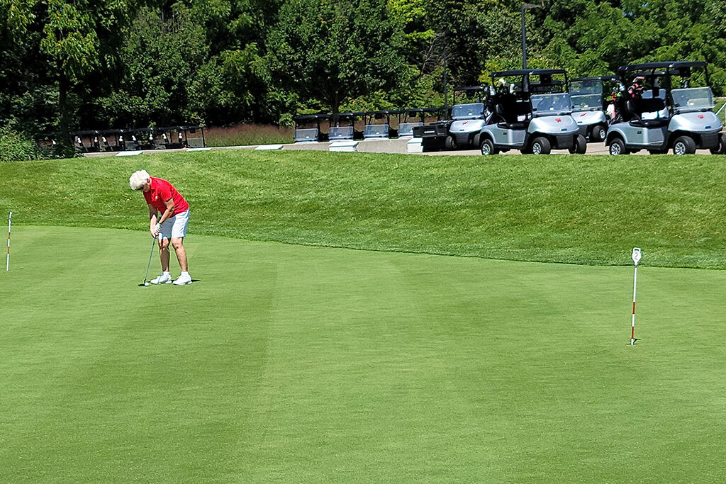 20210813_120406 A Pharm alumni getting ready to putt the golf ball