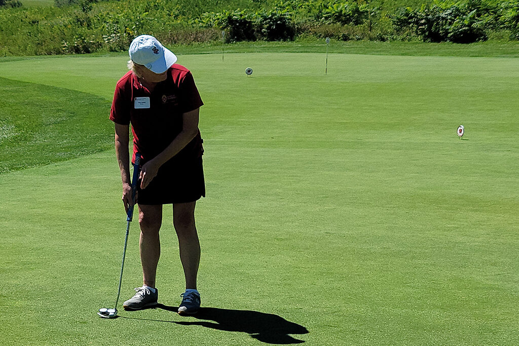 20210813_122053 Pharm alum getting ready to putt a golf ball