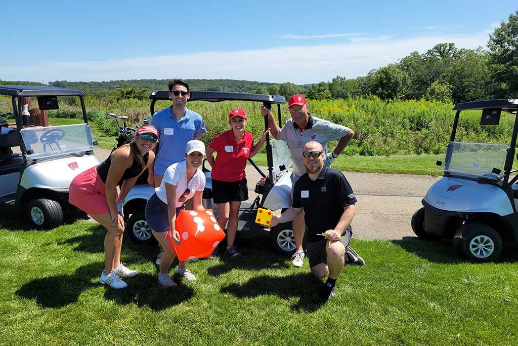 20210813_134512 UW Pharmacy Alumni together next to golf cart
