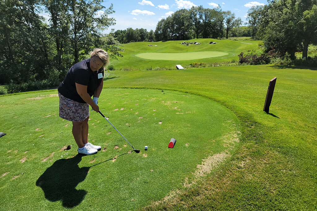 20210813_142653 UW Alumni getting ready to shoot a golf ball
