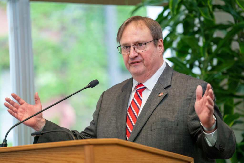 Dean Steve Swanson speaks at the podium
