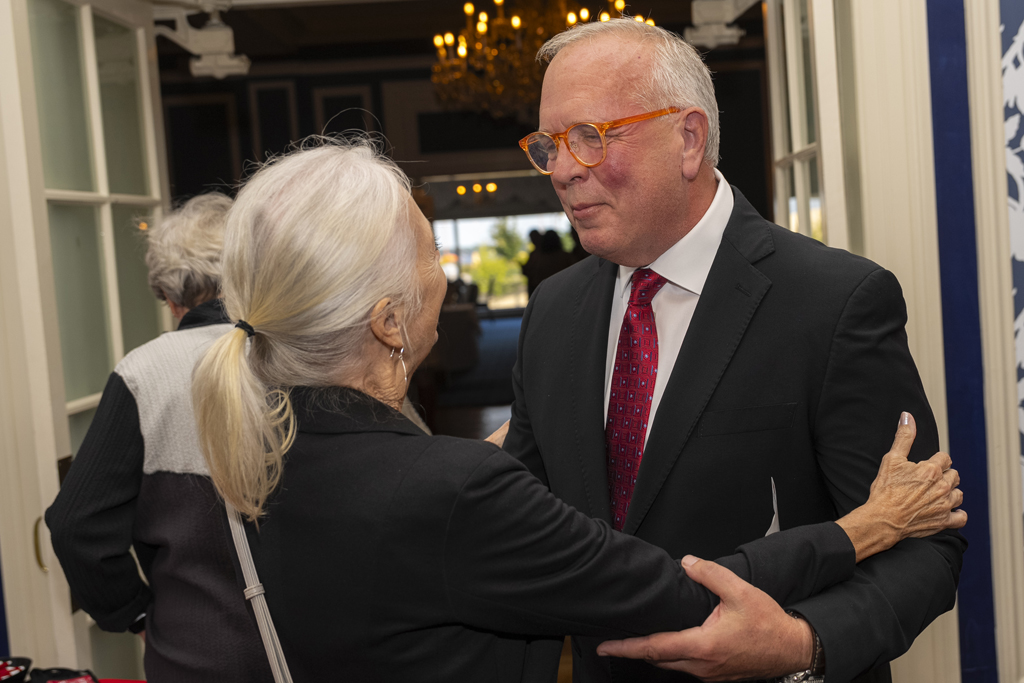 Margaret Ames and Tom McCourt speak arm in arm
