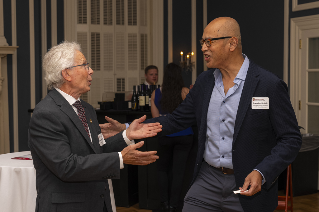 Bob Breslow and Arash Bashirullah animatedly converse