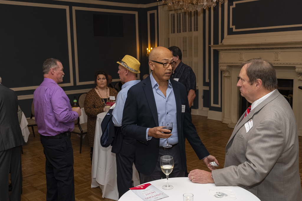 Arash Bashirullah and Dean Steve Swanson speak at a table