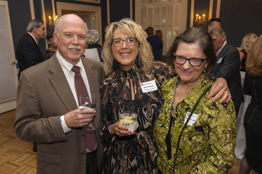 James DeMuth, Pam French, and Ruth Bruskewitz smile for a photo