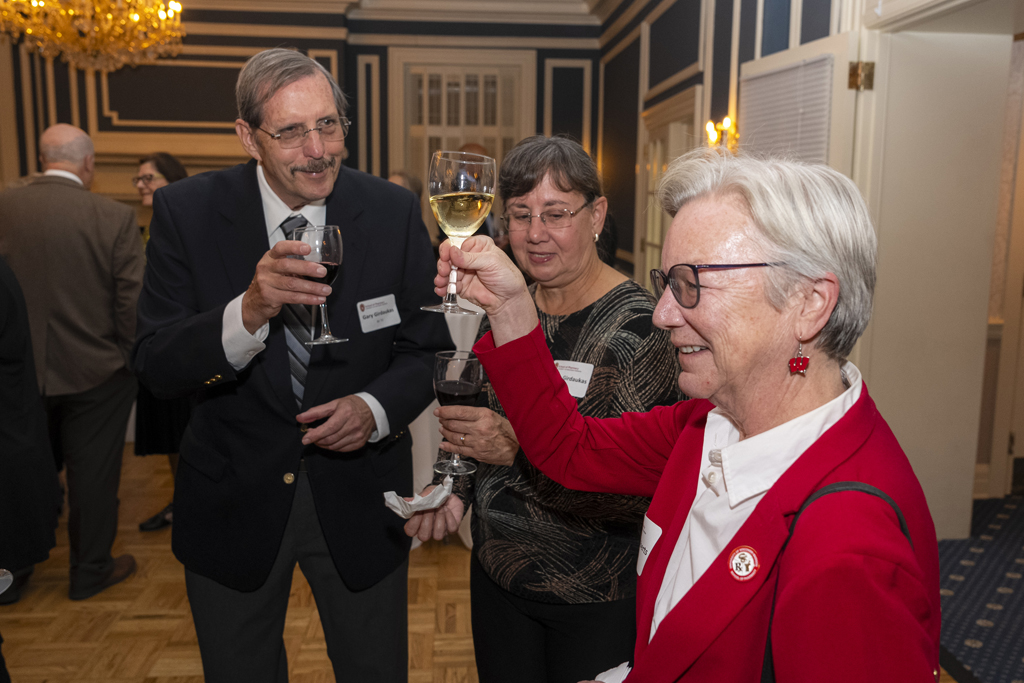 Gary Girdakis and his wife toast with Jeanette Roberts