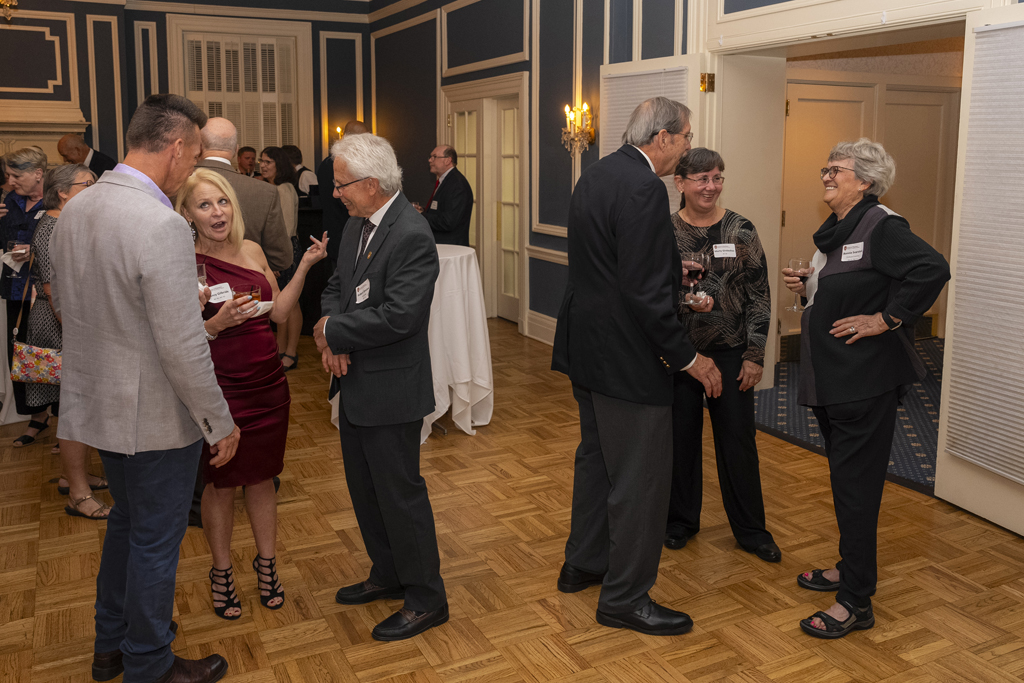 Two groups of Citation attendees mingle
