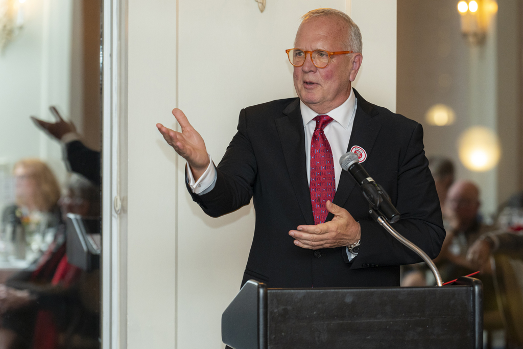 Tom McCourt speaking at the podium