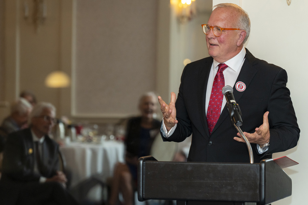 Tom McCourt speaks at the podium