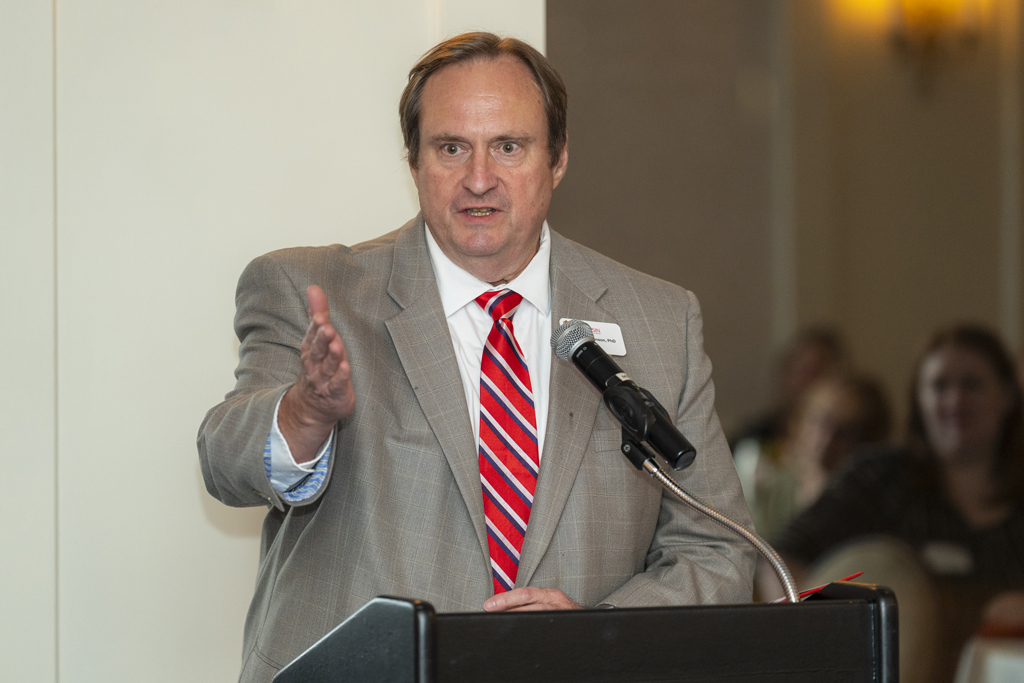 Dean Swanson speaking at the podium