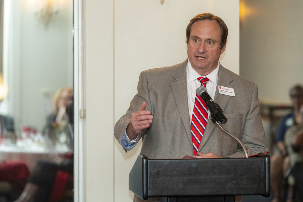 Dean Swanson speaking at the podium