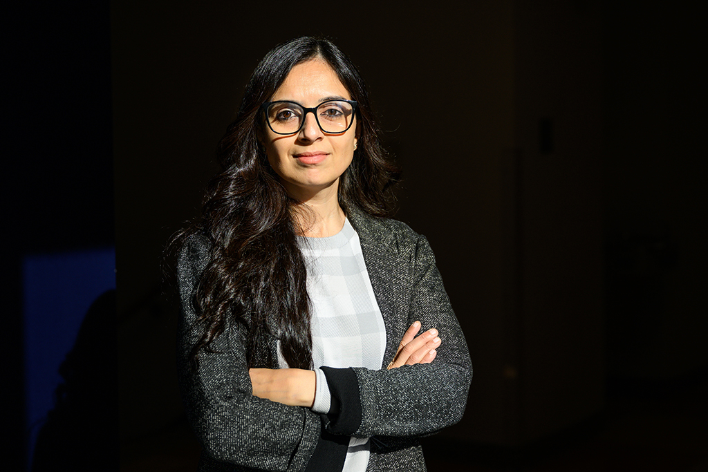 Prachi Arora posed in front of a black background