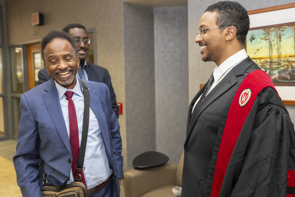 PharmD Graduation Awards Breakfast at the Pyle Center May 10, 2024. A graduate smiles with family