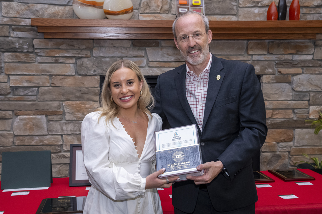PharmD Graduation Awards Breakfast at the Pyle Center May 10, 2024. A graduate receives an award from Dave Mott