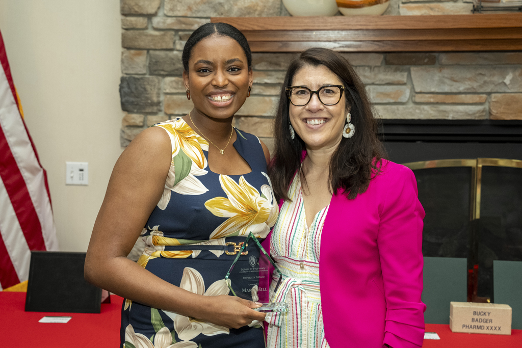 PharmD Graduation Awards Breakfast at the Pyle Center May 10, 2024. Maria Hill receives an award from Lisa Imhoff