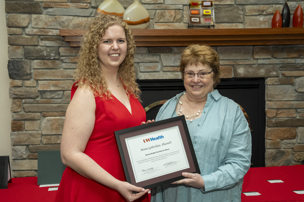 PharmD Graduation Awards Breakfast at the Pyle Center May 10, 2024. Mary Mably presents an award to Maria Golovinka