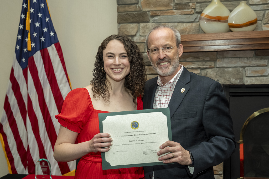 PharmD Graduation Awards Breakfast at the Pyle Center May 10, 2024. Dave Mott presents an award to Katie Frietag