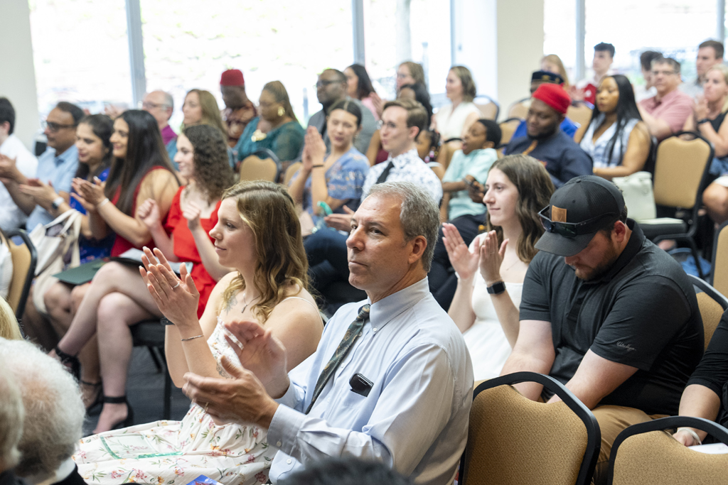 PharmD Graduation Awards Breakfast at the Pyle Center May 10, 2024. Attemdees clap
