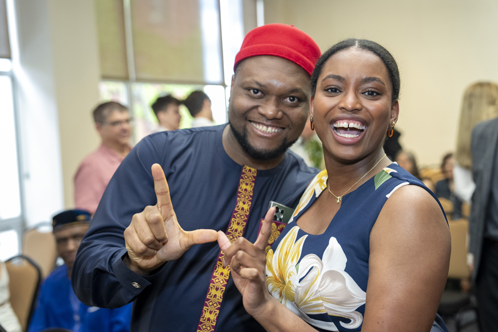 PharmD Graduation Awards Breakfast at the Pyle Center May 10, 2024. Michael Nome and Maria Hill pose for a "w" photo