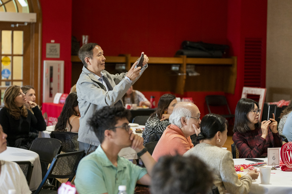 PharmTox Brunch at Carson Gulley May 11, 2024. (Photo © Andy Manis) An attendee takes a photo