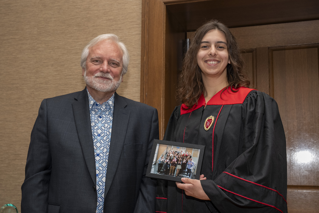PharmTox Brunch at Carson Gulley May 11, 2024. (Photo © Andy Manis) A student accepts a class photo from Jeff Johnson