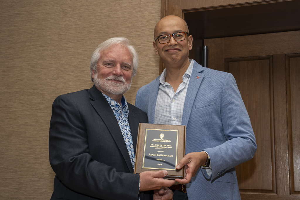 PharmTox Brunch at Carson Gulley May 11, 2024. (Photo © Andy Manis) Arash Bashirullah accepts his Teacher of the Year award from Jeff Johnson