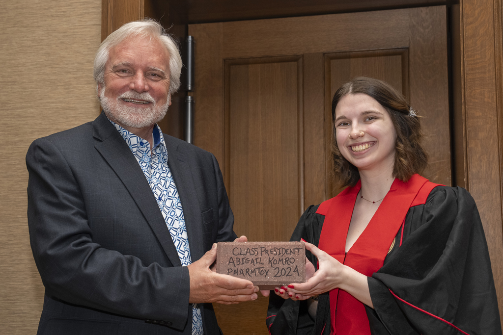 PharmTox Brunch at Carson Gulley May 11, 2024. (Photo © Andy Manis) Abigail Komro receives a Legacy Brick for serving as class president
