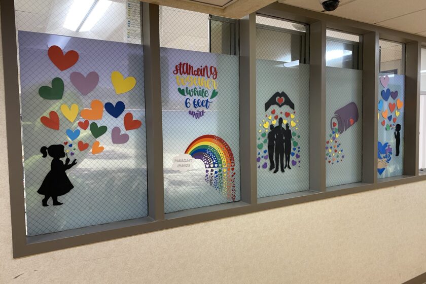 A World of Hearts - Inpatient Pharmacy Colorful paintings on the windows of an inpatient pharmacy.