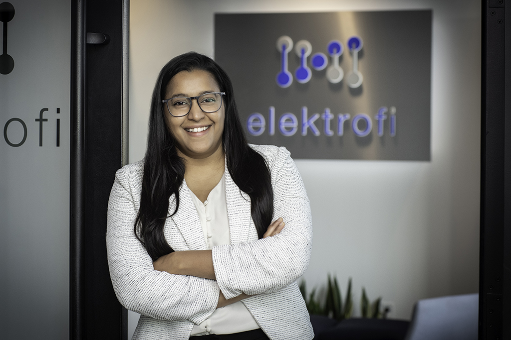 Portrait of Ashita Nair near an Elektrofi sign