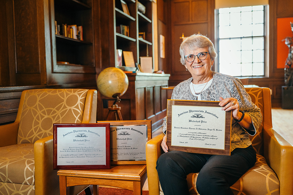 Bonnie Svarstad with her three Wiederholt Prize plaques.