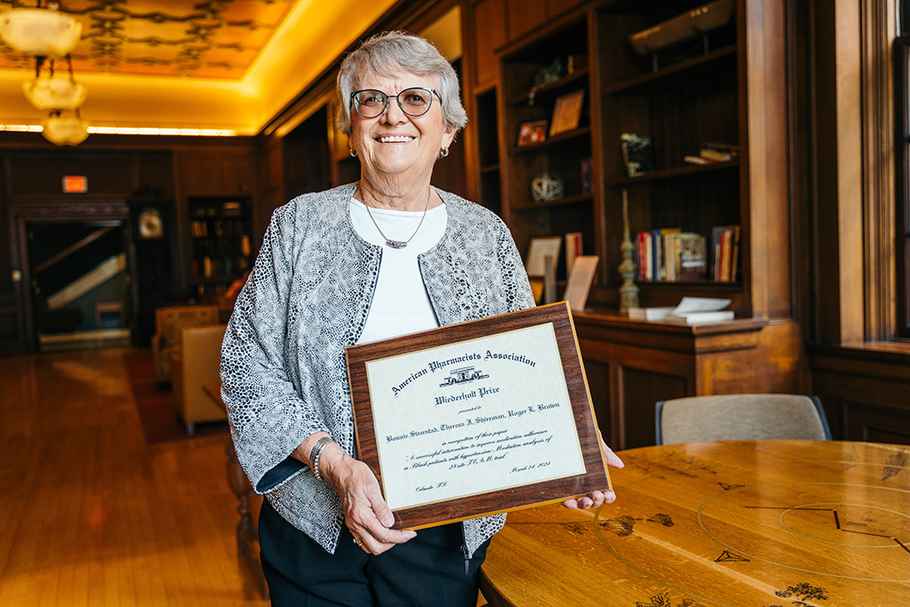 Bonnie Svarstad holds her 2024 Wiederholt Prize.