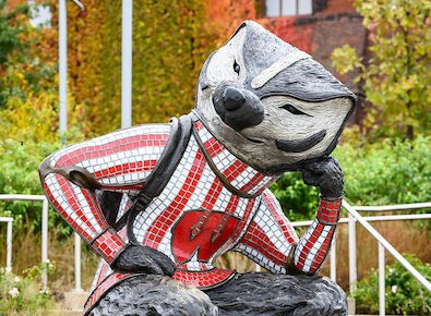statue of Bucky in a thinking pose, with head rested on bent arm