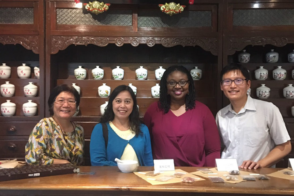 CMU 1, Chinese Medicine Musuem with Margaret and Teacher Yao Olayinka Shiyanbola in Chinese Medicine Museum with staff from China Medical University