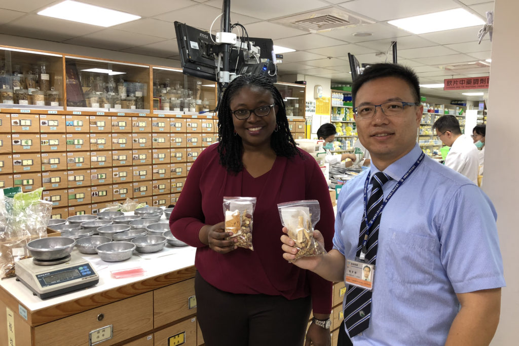 Chinese medicine preparations by Rxs with Jack 2 Olayinka Shiyanbola holding a bag of chinese medicine with Jack