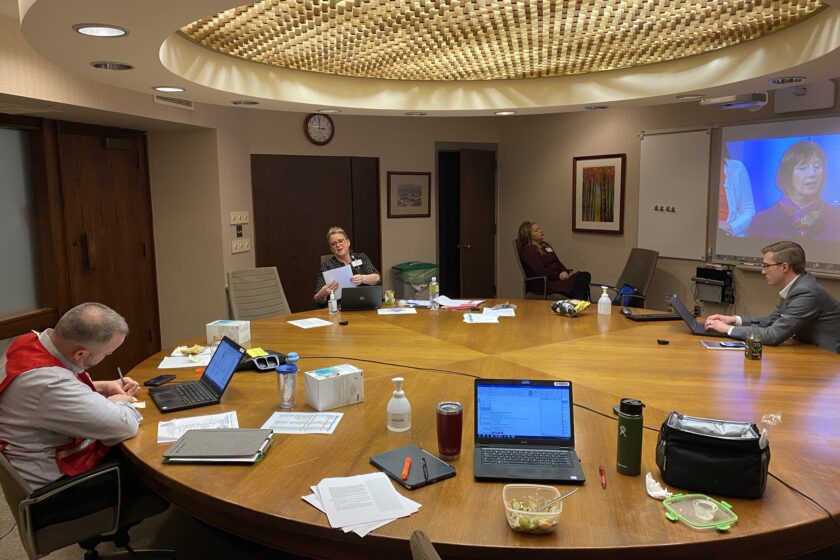Command Center (Nick Ladell, Holly Schmidtke, Cyndee Hanse, Matt Fenhaus) The incident command team meeting around a table.