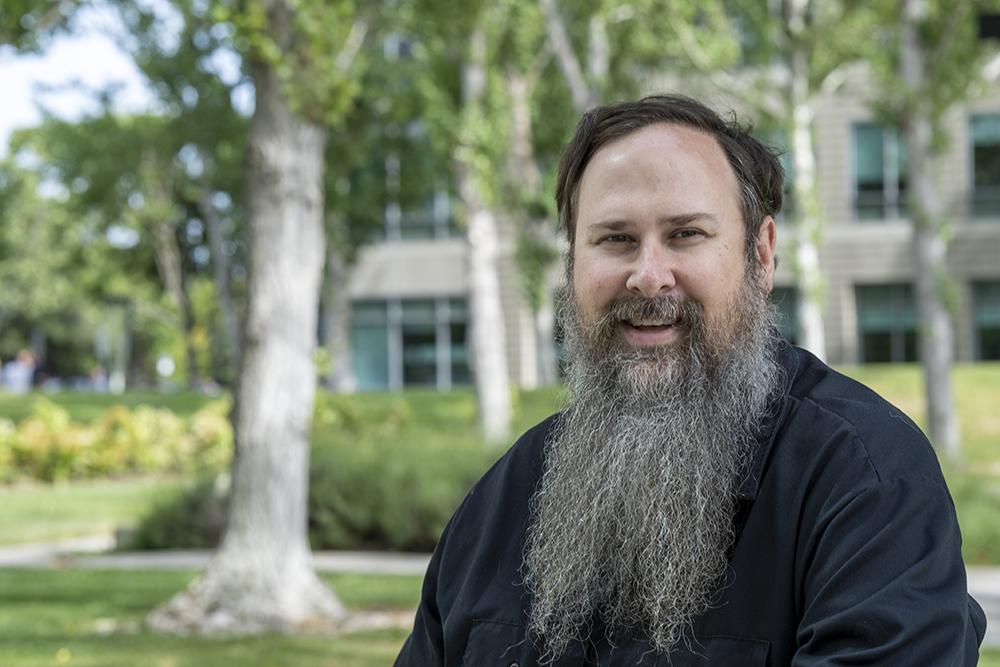 Richard Gantt smiles outside of the 10x Genomics building.